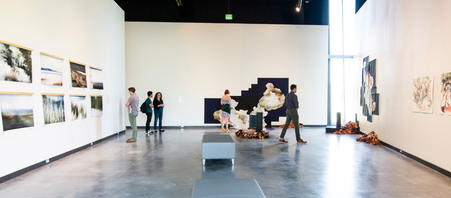 A photo of people enjoying the Edge and Mirror exhibition in the Blue Galleries at the Center for the Visual Arts, 2019, photograph by Allison Corona